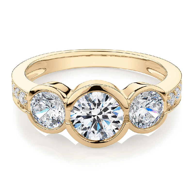 Engagement Rings with Sapphire-Three stone ring with 2.11 carats* of diamond simulants in 10 carat yellow gold