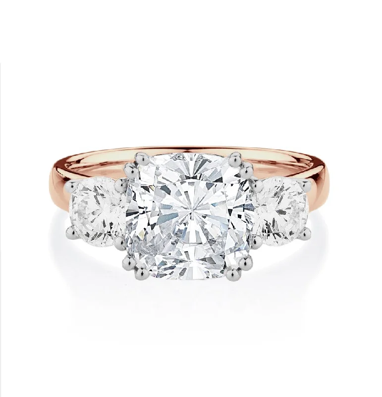 Simple Engagement Rings-Three stone ring with 3.75 carats* of diamond simulants in 10 carat rose and white gold