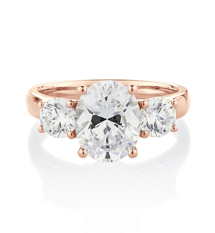 Elegant Rose Gold Rings-Three stone ring with 3.5 carats* of diamond simulants in 10 carat rose gold