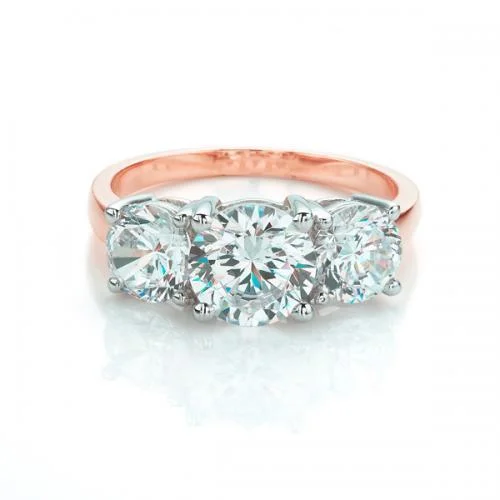 Solitaire Diamond Wedding Rings-Three stone ring with 3 carats* of diamond simulants in 10 carat rose and white gold