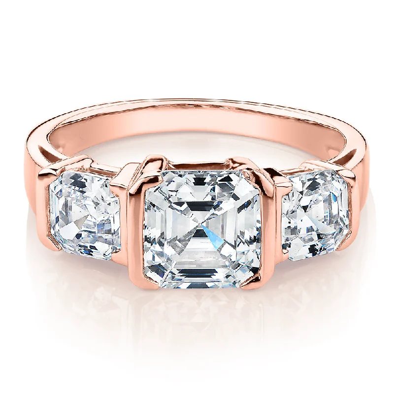 Luxury Diamond Rings-Three stone ring with 3.38 carats* of diamond simulants in 10 carat rose gold