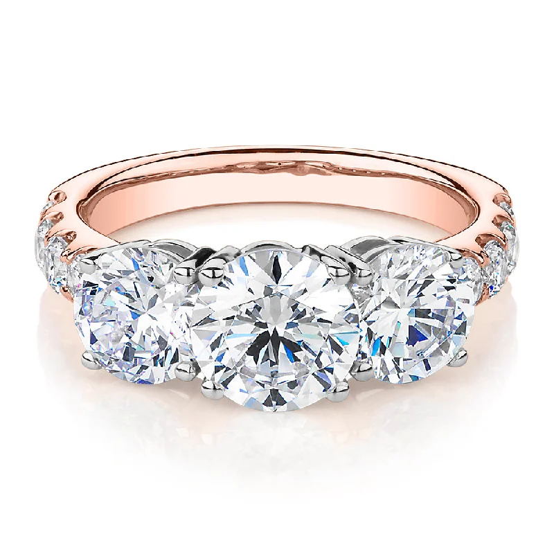 Unique Promise Rings-Three stone ring with 3.44 carats* of diamond simulants in 10 carat rose and white gold