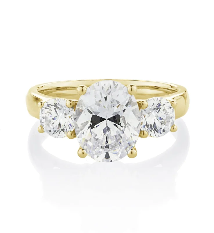 Simple Diamond Rings-Three stone ring with 3.5 carats* of diamond simulants in 10 carat yellow gold